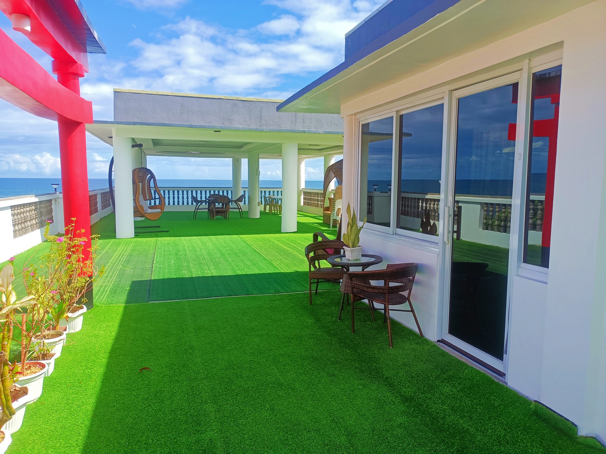 Ocean-facing terrace at Aloha Beach Resort